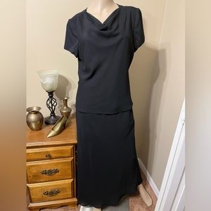Black polyester chiffon skirt and cowl neck short sleeve top.  Midi length.